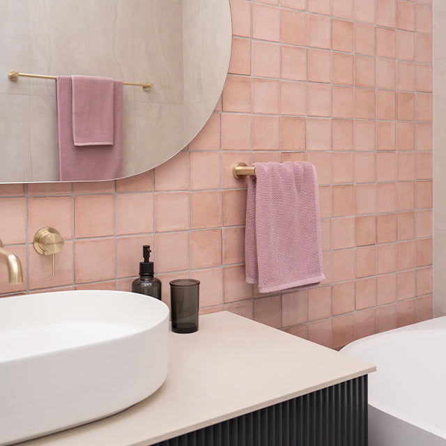 Nero brushed gold hand towel rail, pink dianna tiles, ingrain vanity, Nero gold tapware | Cam and Jules bathroom collaboration with The Blue Space