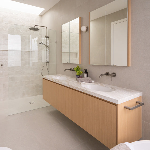 Caroma Liano brushed nickel taps, accessories, shower and Urbane II Cleanflush toilet suite | Timberline shaving cabinet | Modern Bathroom Renovation | The Blue Space