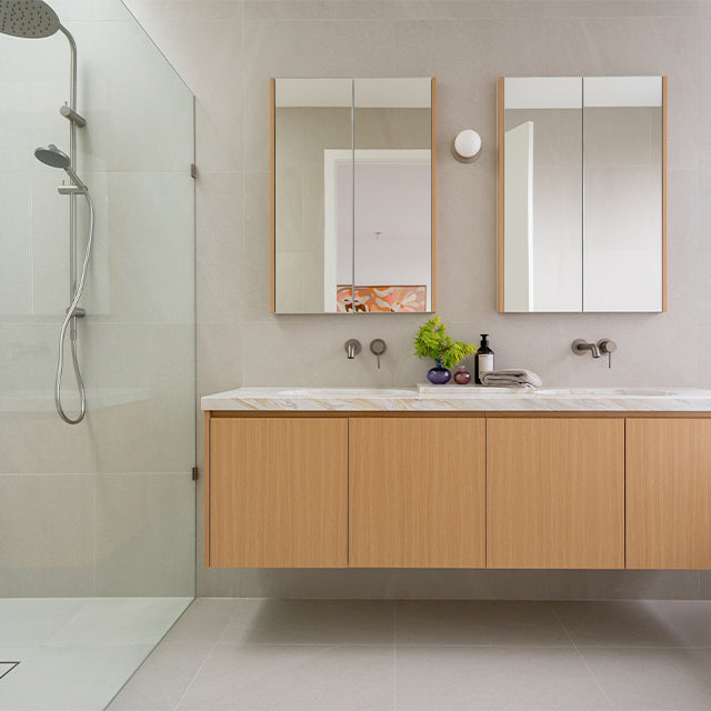 Caroma Liano brushed nickel basin and shower taps | Timberline Shaving Cabinet | Modern Melbourne Bathroom Renovation | The Blue Space
