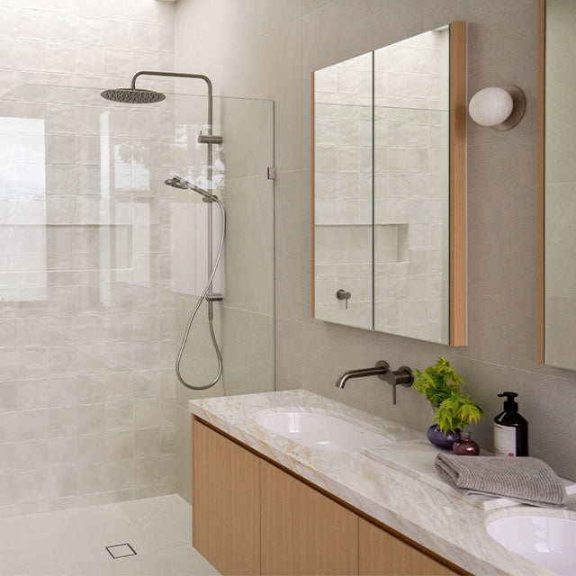 Caroma Liano brushed nickel taps, accessories, shower and Urbane II Cleanflush toilet suite | Timberline shaving cabinet | Modern Bathroom Renovation | The Blue Space