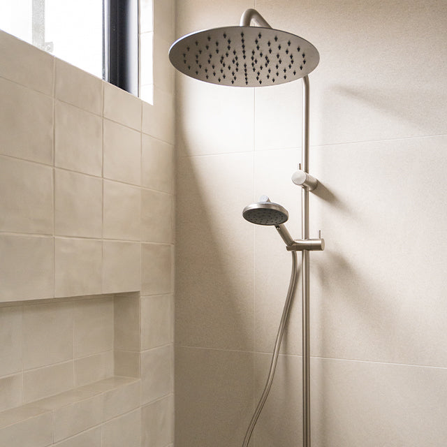 Caroma Liano brushed nickel taps, accessories, shower and Urbane II Cleanflush toilet suite | Timberline shaving cabinet | Modern Bathroom Renovation | The Blue Space