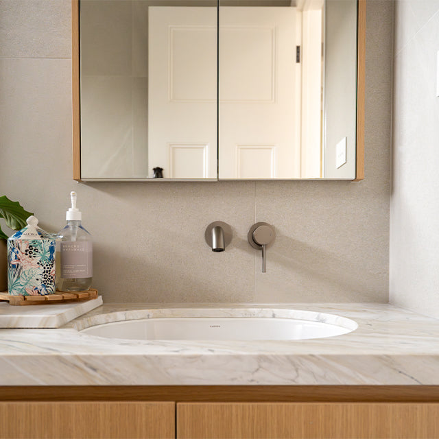 Caroma Liano brushed nickel basin taps | Mirrored shaving cabinet| Modern Melbourne Bathroom Renovation | The Blue Space